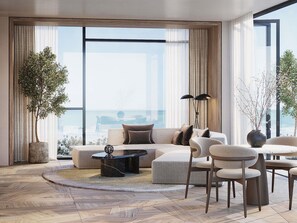 A modern living room with a sofa, chairs, a coffee table, and large windows offering a view of the ocean. - Delano Dubai (Dubai)