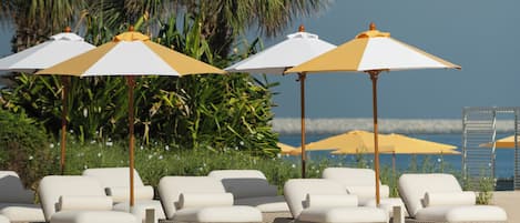 Outdoor pool, open 8:00 AM to 7:00 PM, cabanas (surcharge)