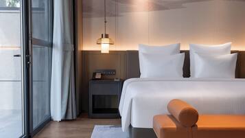 Premium bedding, down duvets, free minibar items, in-room safe
