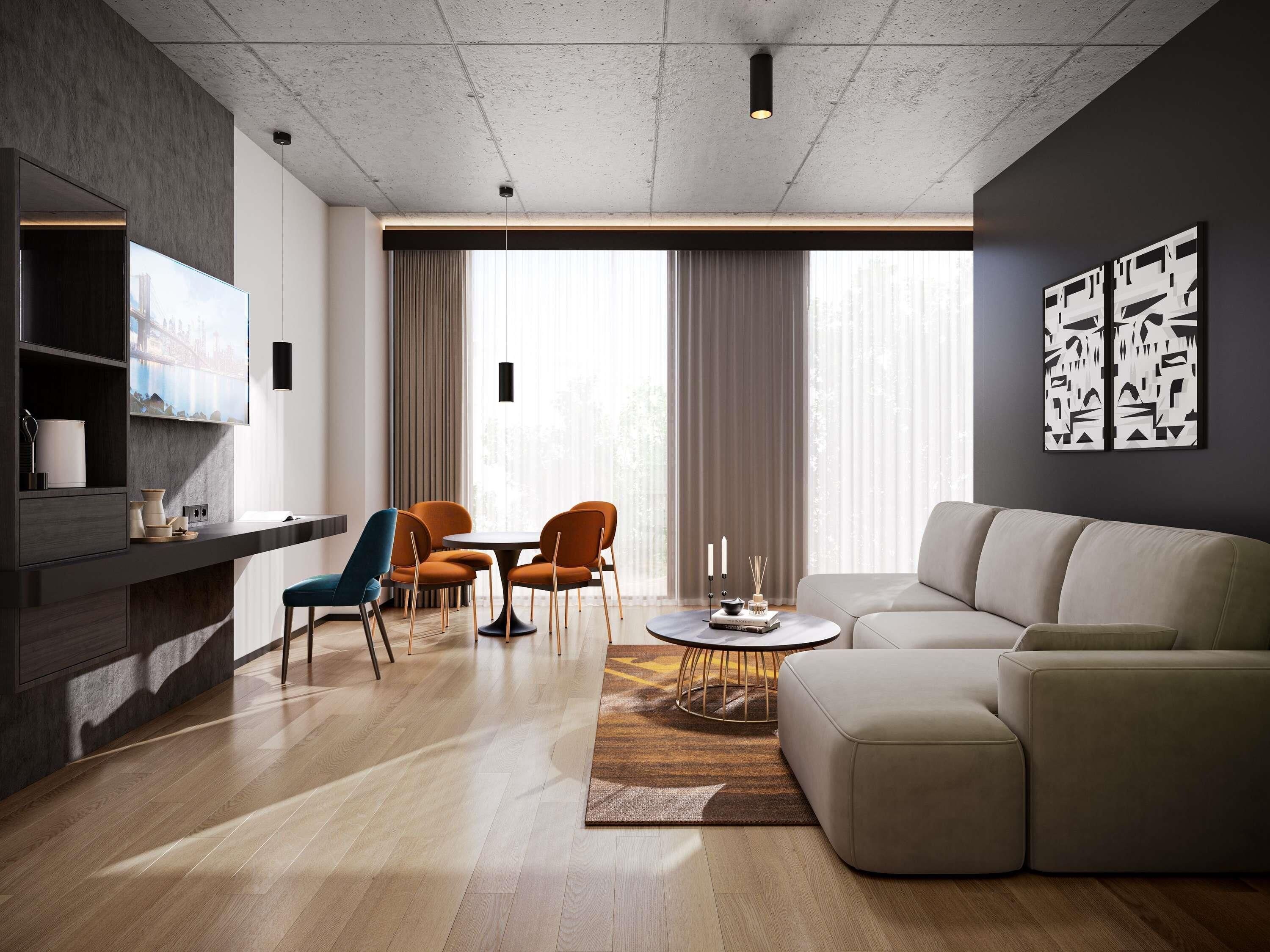 Una sala moderna con sofá, sillas, una mesa de centro y televisor.
