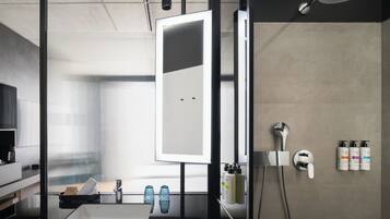 Shower, designer toiletries, hair dryer, bathrobes