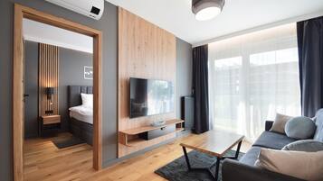 Comfort Apartment | Living room | 27-inch flat-screen TV with digital channels