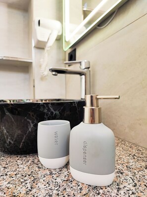 Shower, hair dryer, towels, soap