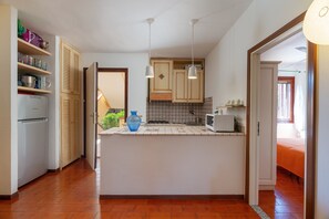 Apartment | Private kitchen | Full-sized fridge, microwave, oven, stovetop