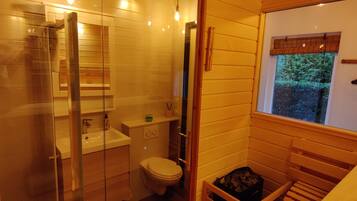 Shower, hair dryer, towels, soap