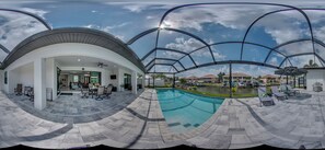 Outdoor pool, a heated pool - Luxury Villa Rossi in modern design with saltwater pool on the canal build 2023 (Cape Coral)