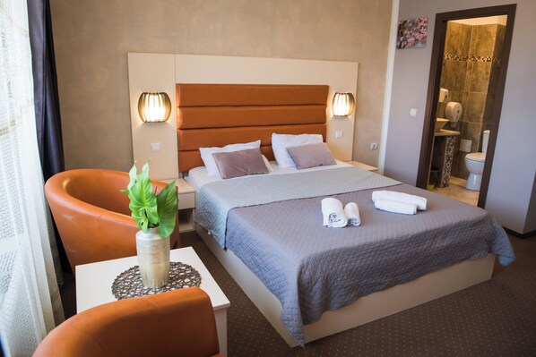 Premium bedding, memory-foam beds, laptop workspace, free WiFi