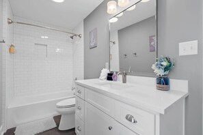 Shower, hair dryer, towels, shampoo