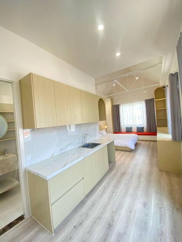 Deluxe Studio Suite | Living area | TV
