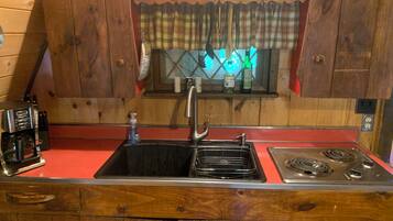 Fridge, microwave, stovetop, coffee/tea maker