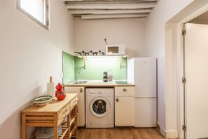 Fridge, microwave, coffee/tea maker, cookware/dishes/utensils