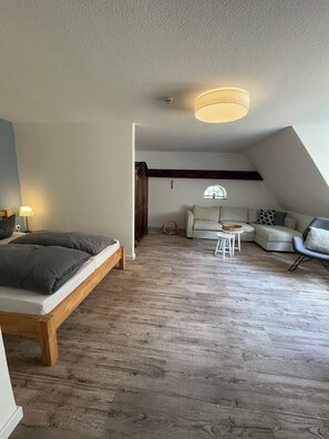 Junior Suite | Living area | 42-inch Smart TV with satellite channels