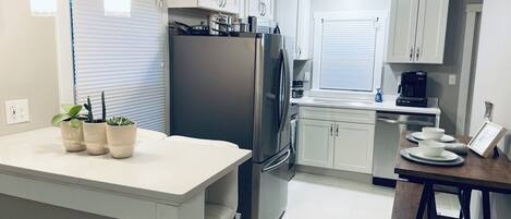 Coffee/tea maker, fridge, microwave, oven