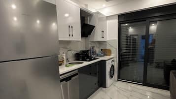 Apartment | Private kitchen | Fridge, stovetop, dishwasher, cookware/dishes/utensils