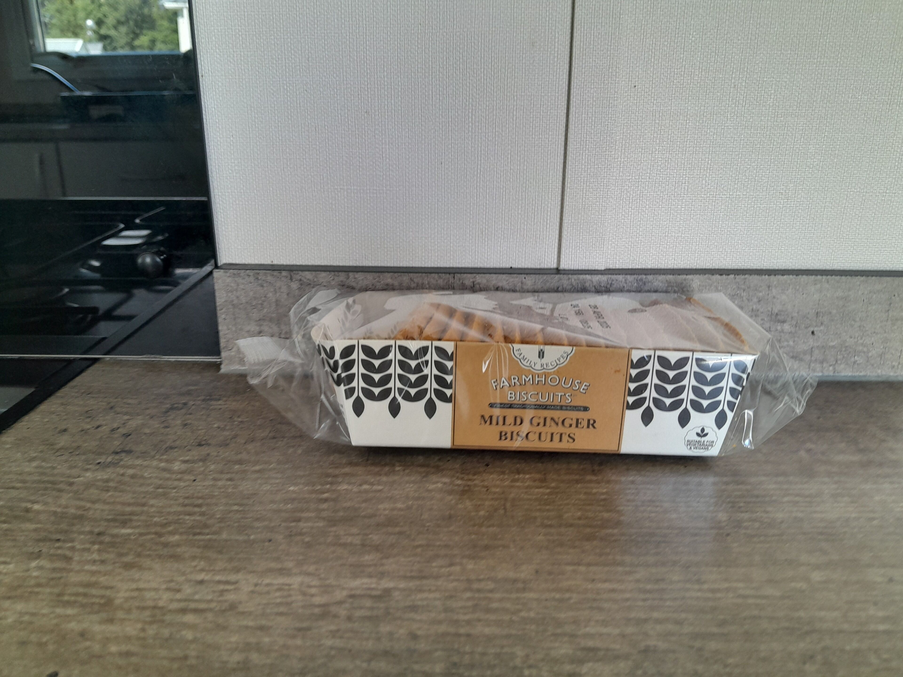 A box of Farmhouse Biscuits on a kitchen counter.