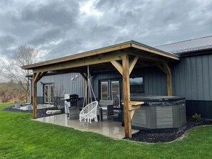 Terrace/patio - Charming 2 Bedroom Home with Hot Tub and Fire Pit (Byron Center)