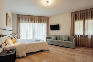 Standard Quadruple Room, Balcony | Desk, laptop workspace, free WiFi, bed sheets