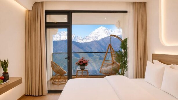 A bedroom with a bed, a hanging chair, and a view of mountains. - Shenfeng Juyuan View Hotel (Deqin)