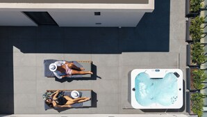 An aerial view of a rooftop with two sun loungers and a hot tub. - Vision Lavraga (Athens)