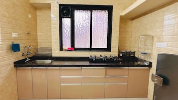 Fridge, stovetop, cookware/dishes/utensils, dining tables