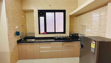 Fridge, stovetop, cookware/dishes/utensils, dining tables