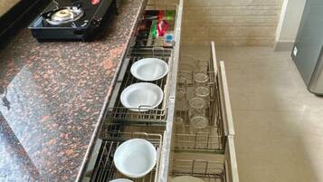 Fridge, stovetop, cookware/dishes/utensils, dining tables