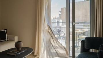 Exclusive Apartment, Balcony, City View | Minibar, in-room safe, laptop workspace, soundproofing