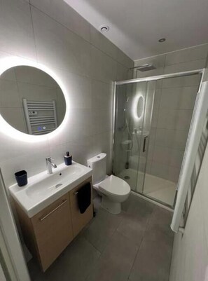 Shower, hair dryer, towels, soap