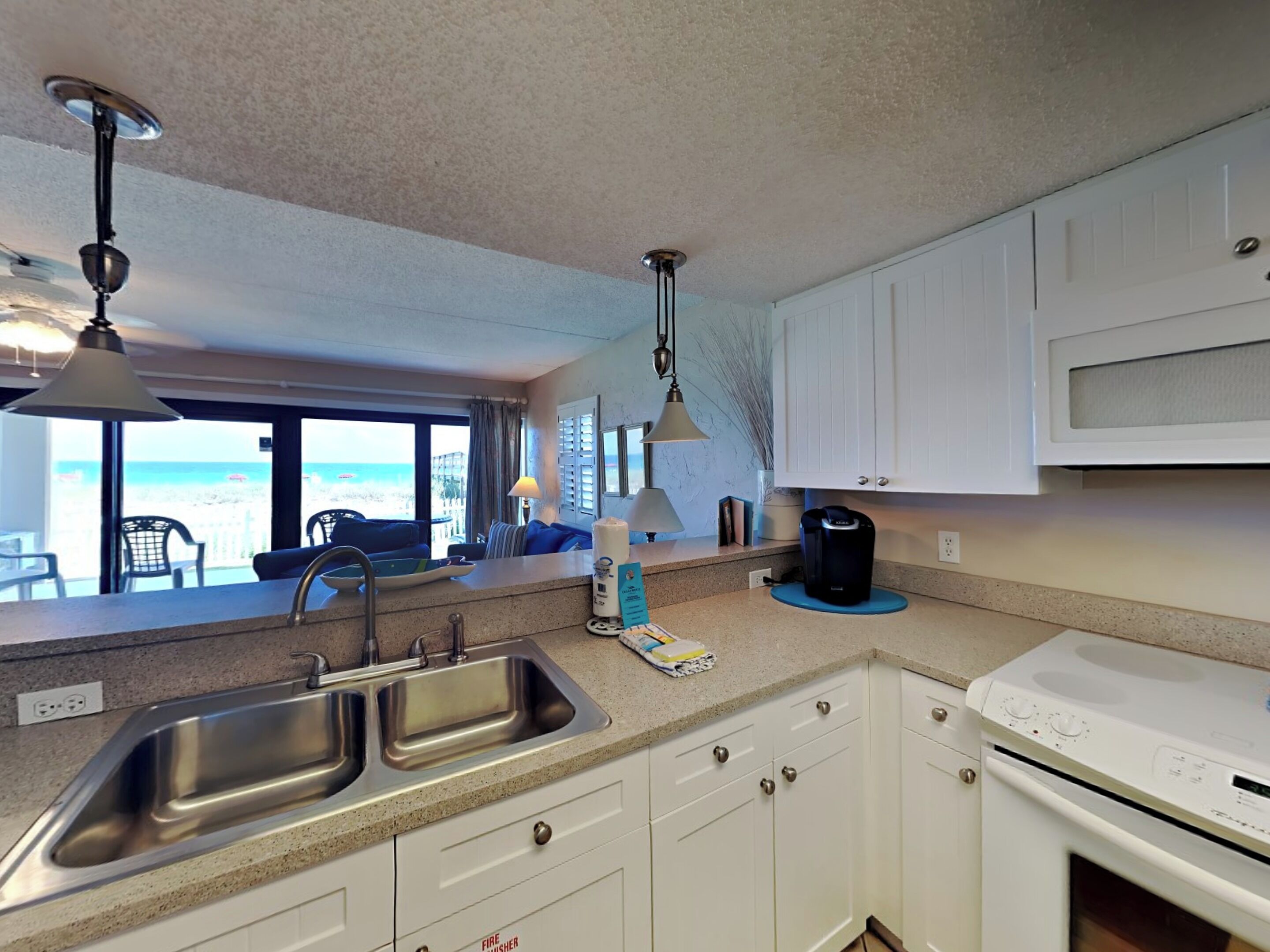 Condo, Multiple Beds, Balcony, Ocean View (Ocean Breeze West #106) | Private kitchen | Fridge, microwave, oven, stovetop
