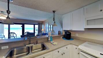Condo, Multiple Beds, Balcony, Ocean View (Ocean Breeze West #106) | Private kitchen | Fridge, microwave, oven, stovetop