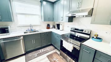 Microwave, electric kettle, toaster, cookware/dishes/utensils