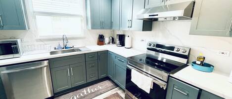 Microwave, electric kettle, toaster, cookware/dishes/utensils