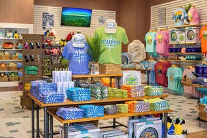 A retail store with various merchandise including t-shirts, hats, and accessories.