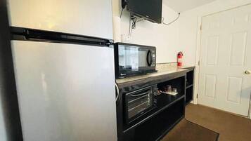 Fridge, microwave, coffee/tea maker, cookware/dishes/utensils