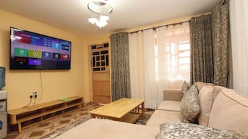 Superior Suite, 2 Bedrooms | Living area | Smart TV