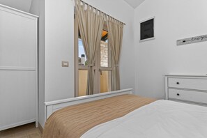 2 bedrooms, in-room safe, iron/ironing board, travel cot
