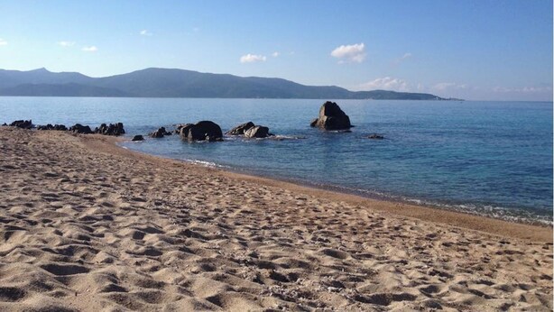 A sandy beach with clear blue water and distant mountains. - 10 people sea view villa with pool in the south part of Corsica (Olmeto, Abbartelo)