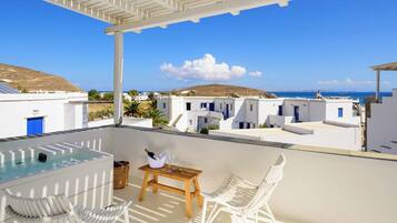 Deluxe Suite, Balcony, Partial Sea View | In-room safe, soundproofing, travel crib, free WiFi