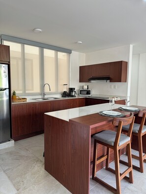 Family Apartment, 2 Bedrooms, City View | In-room dining - Nabani Condominios T1 (Santa María Huatulco)