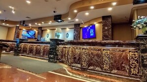 A reception area with marble counters, multiple screens, and a 'Information' sign. - Harbin Kunlun Hotel (Near Central Street & Harbin Railway Station) (Harbin)