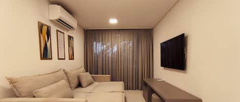 Family Apartment | Living area | 38-inch TV with satellite channels