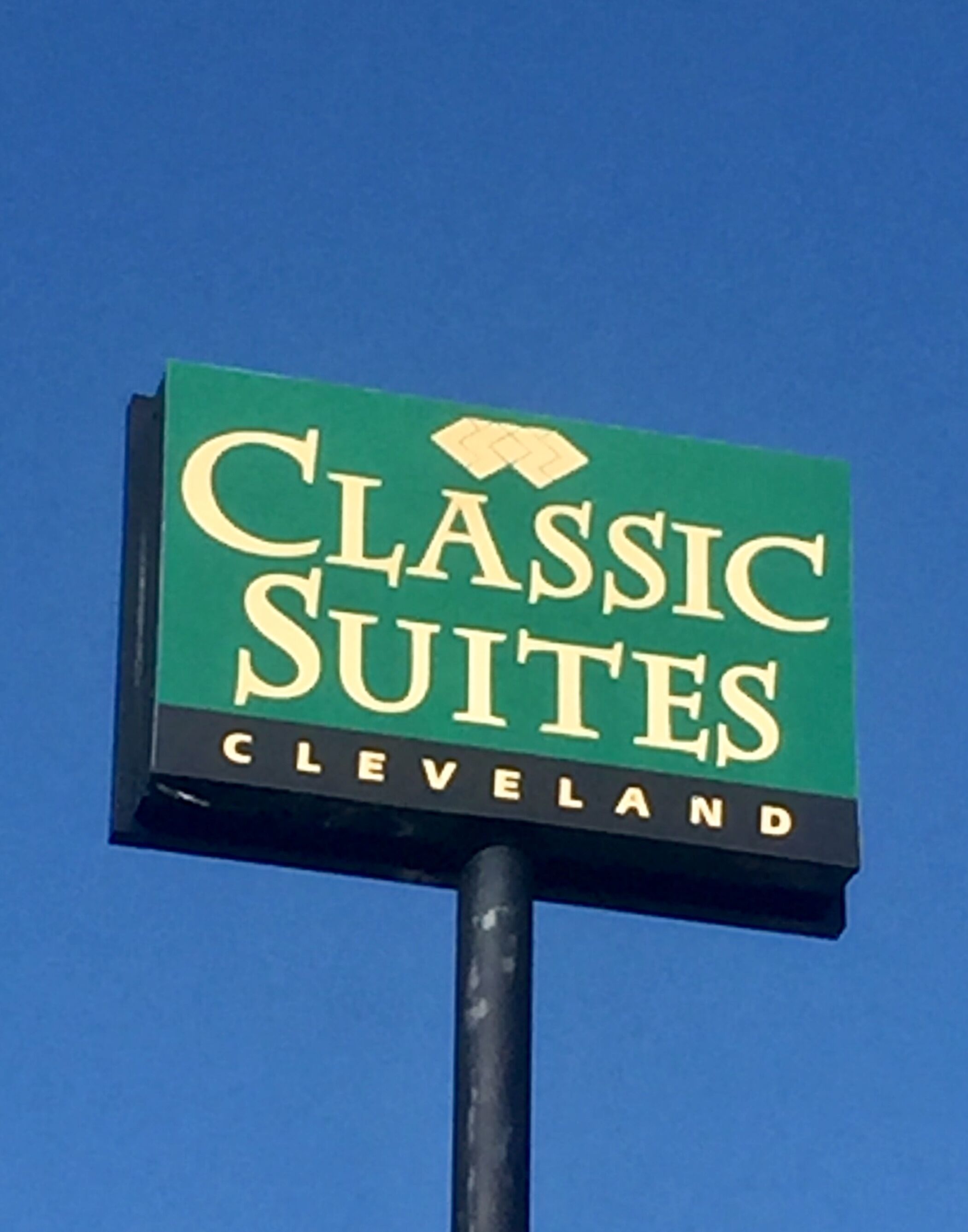 A sign for Classic Suites in Cleveland.