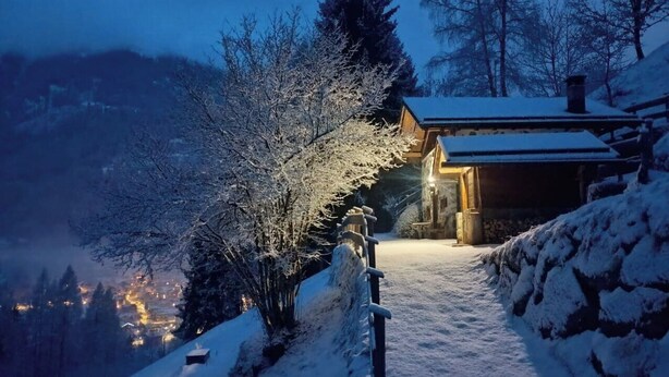 A snow-covered landscape with a wooden cabin and a snow-covered path leading to it. - Chalet Maso Salam (Bocenago)