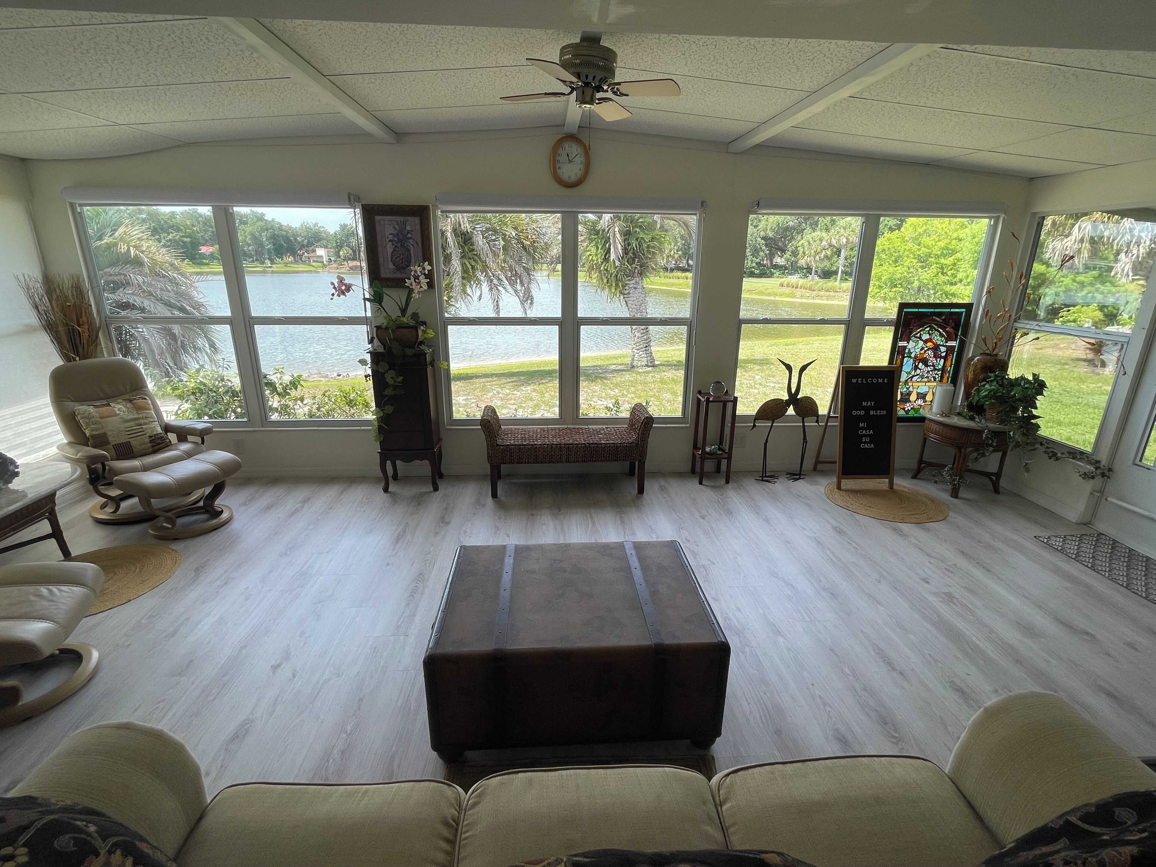 PARADISE LAKE reflects shoreline park into this beautiful home in The Villages. 