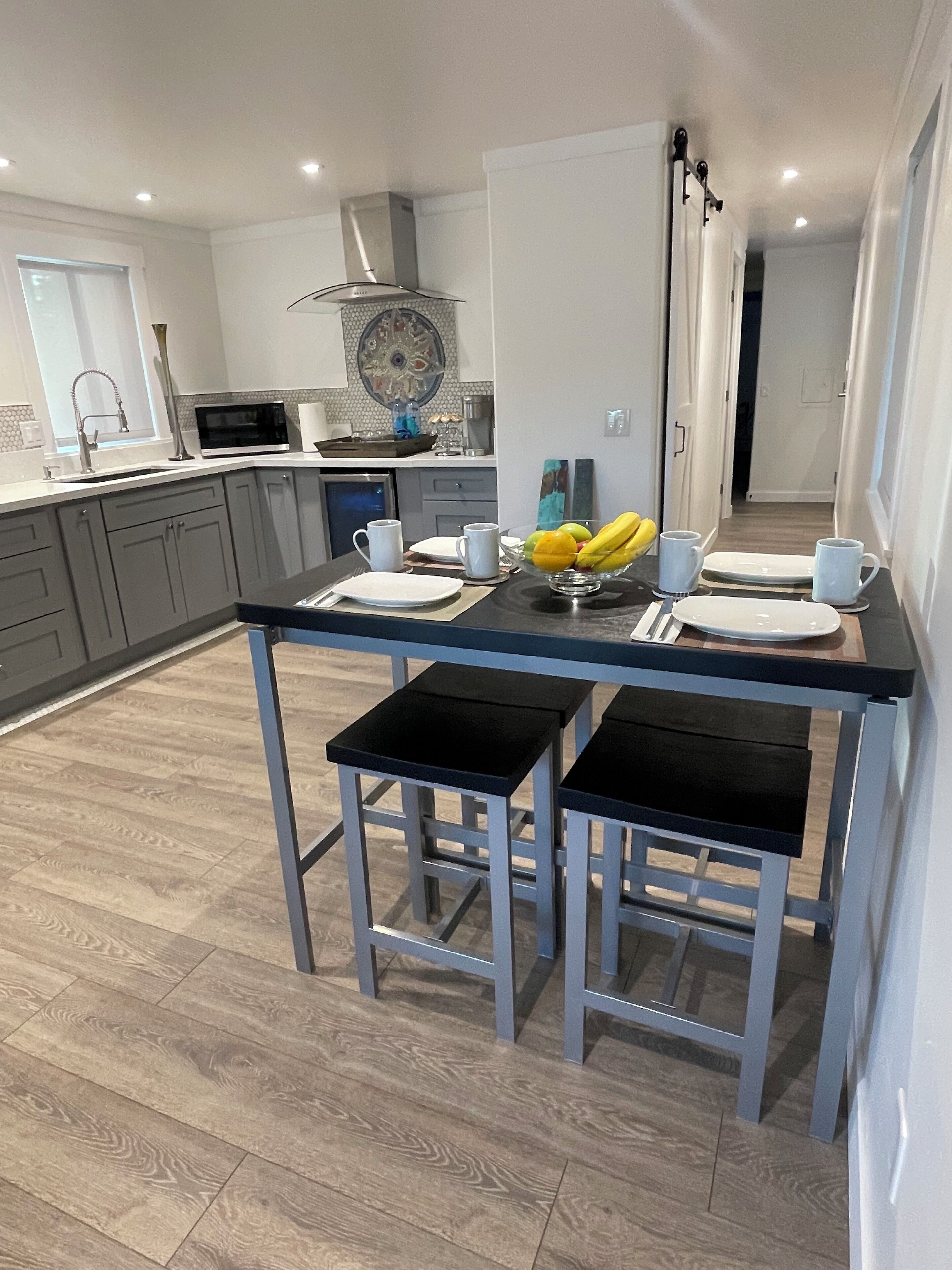 Fridge, microwave, stovetop, coffee/tea maker