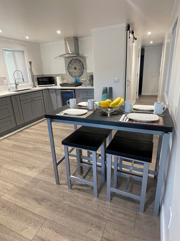 Fridge, microwave, stovetop, coffee/tea maker