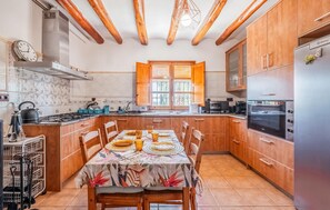 Fridge, stovetop, dishwasher, coffee/tea maker