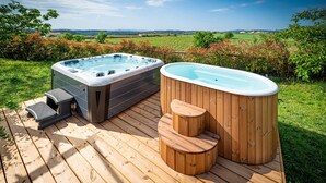 Two hot tubs on a wooden deck with a scenic countryside view. - Cozy home in Guardiola de Fontrubí with sauna (Guardiola de Fontrubí)