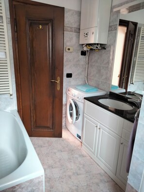 Hair dryer, bidet, towels, soap