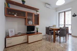 Apartment, Balcony, City View | Living area | 35-inch TV with digital channels, DVD player - A Casa di Enza by Wonderful Italy (Turin)